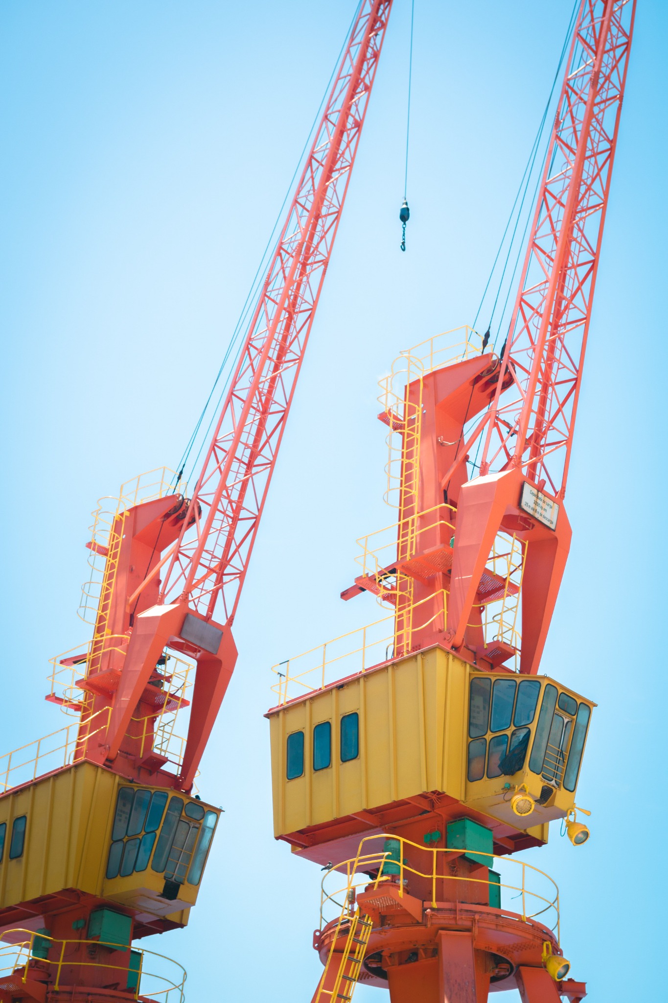 Large port cranes against blue sky